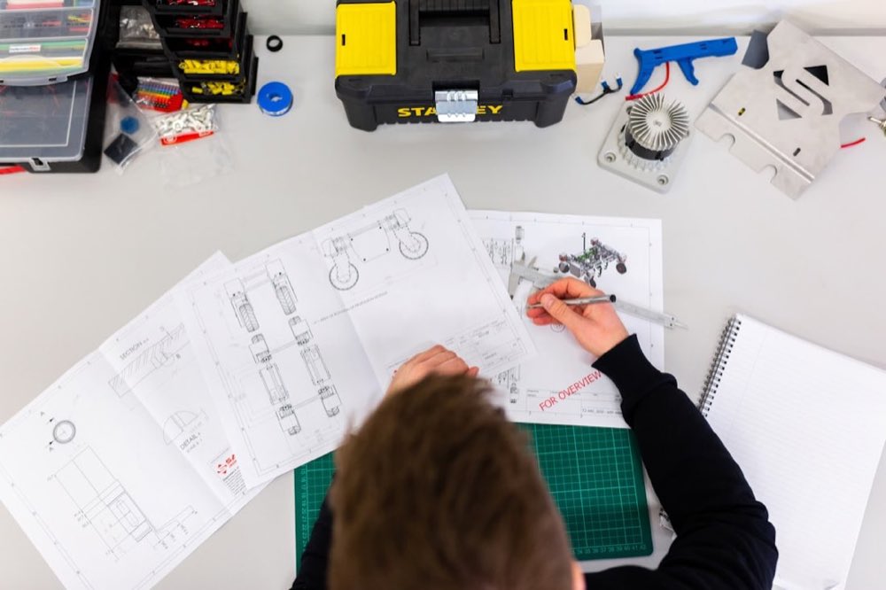 Facilities engineer carrying out planned preventative maintenance on building plant